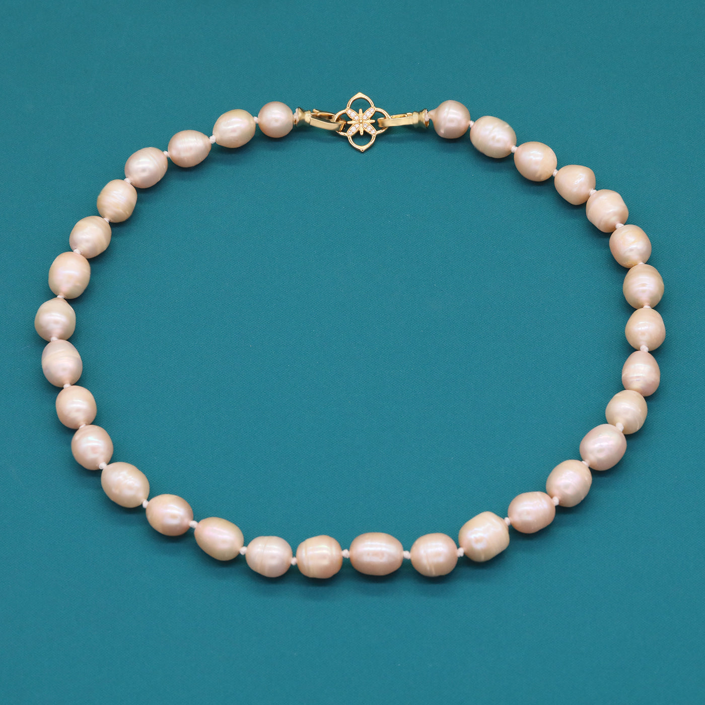A beautiful 100% handmade, freshwater pearl necklace with golden flower buckle, 10mm, perfect for bridal jewelry, Mother's Day, birthday gifts, parties, giving the perfect ideal gift choice