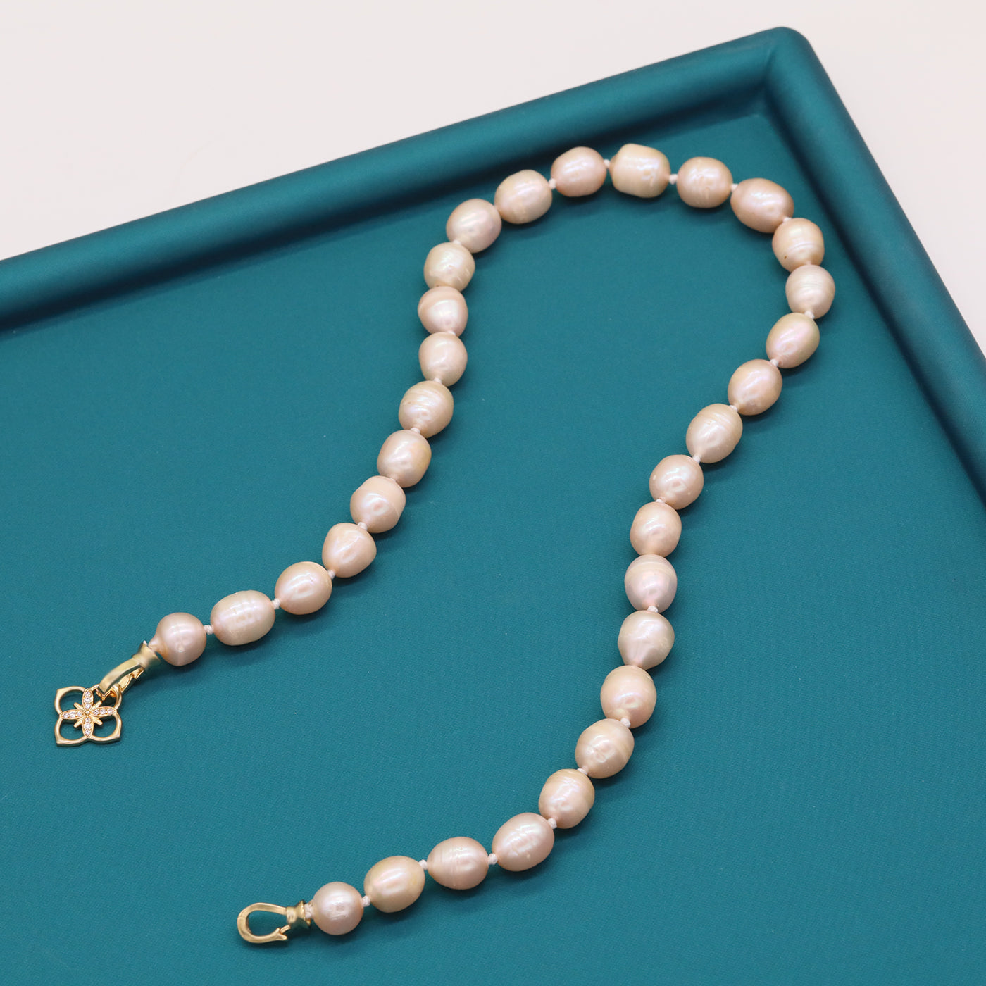 A beautiful 100% handmade, freshwater pearl necklace with golden flower buckle, 10mm, perfect for bridal jewelry, Mother's Day, birthday gifts, parties, giving the perfect ideal gift choice