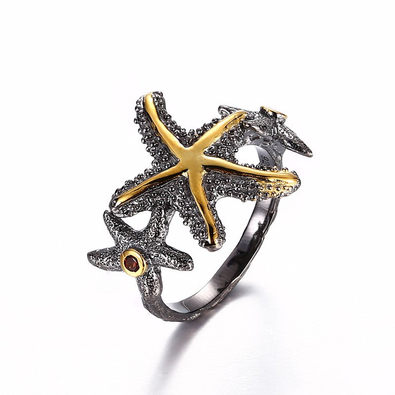 Starfish ring with 2 garnet stones