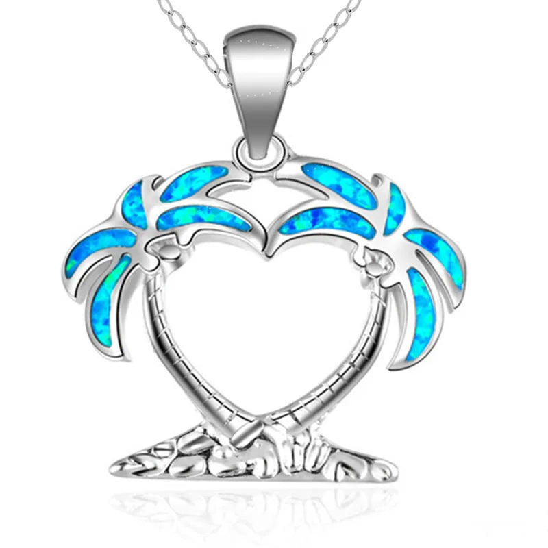 A sterling silver necklace featuring a pendant shaped like two embracing palm trees with vibrant blue opal inlay, shown on a clean white background.