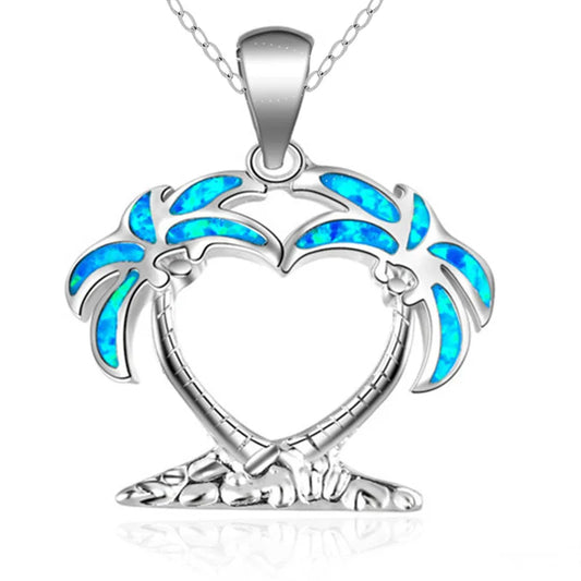 A sterling silver necklace featuring a pendant shaped like two embracing palm trees with vibrant blue opal inlay, shown on a clean white background.