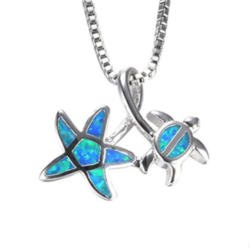 Necklace with a starfish and turtle pendant featuring blue opal inlay on a white background