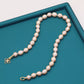 A beautiful 100% handmade, freshwater pearl necklace with golden flower buckle, 10mm, perfect for bridal jewelry, Mother's Day, birthday gifts, parties, giving the perfect ideal gift choice