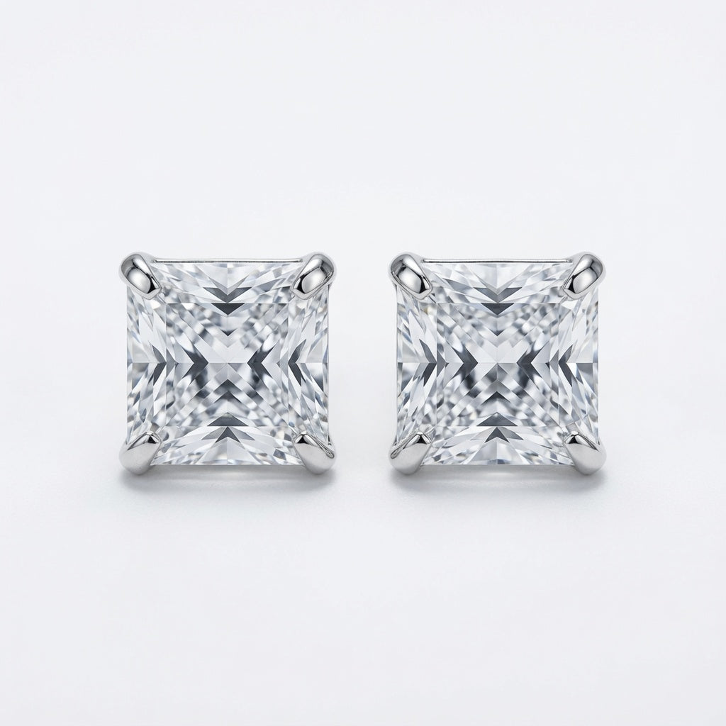 Pair of square-cut diamond stud earrings on a white background