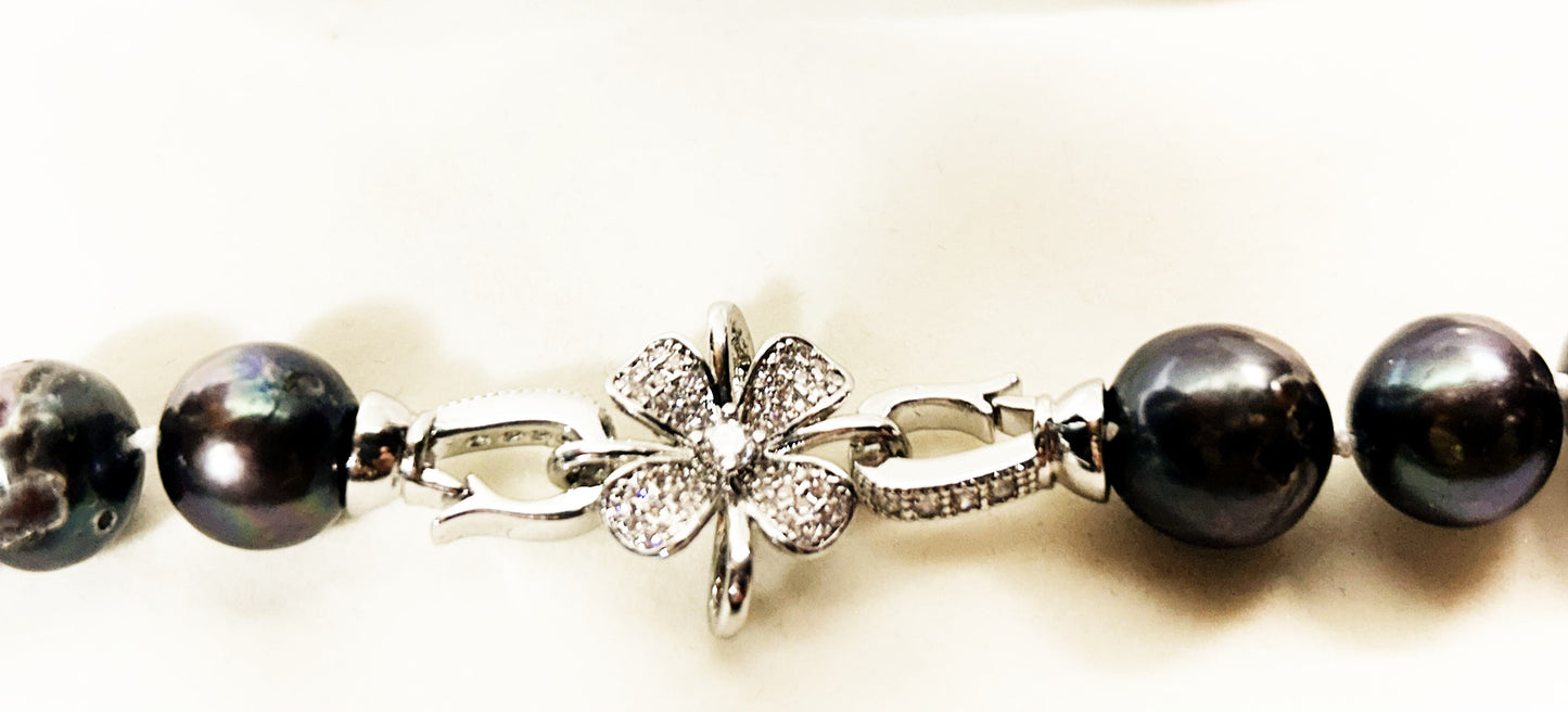 20 inch Elegant black freshwater pearl necklace with cz flower silver clasp