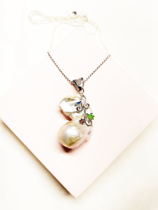 Pearl necklace with a pendant on a PINK  background