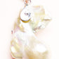 Cat-shaped pearl pendant with a clear gemstone on a white background