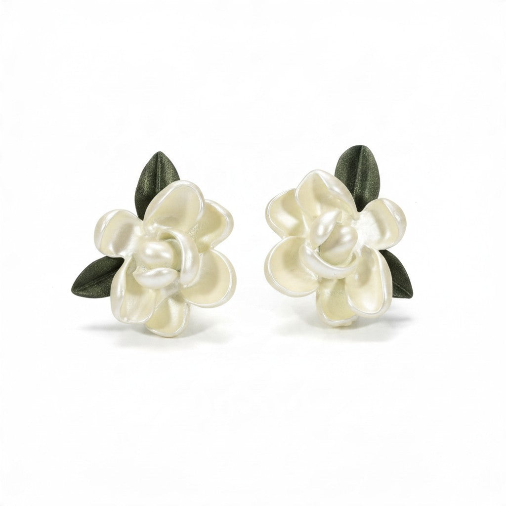 Providence Wholesale Silver floral stud earrings with white layered petals and green leaf accents.