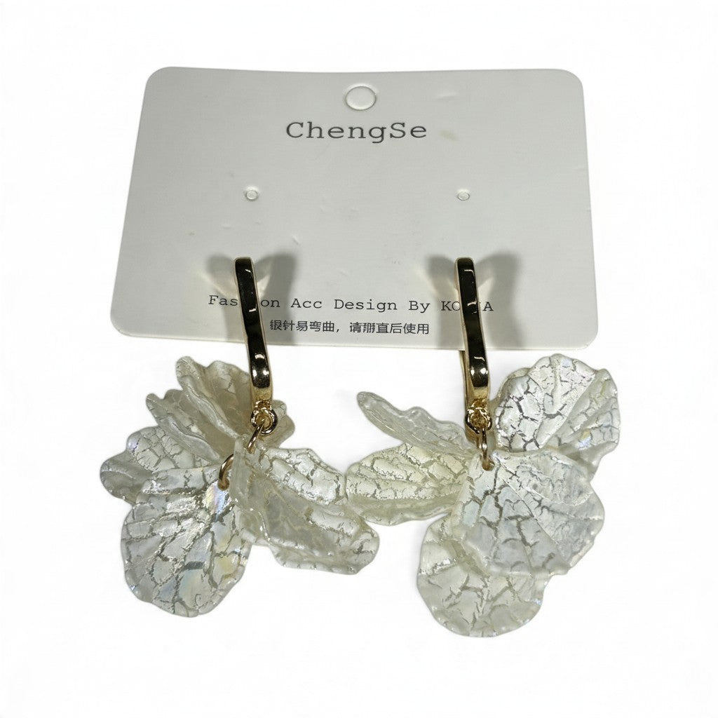 Providence Wholesale Silver floral petal drop hoop earrings with textured white charms on a display card.