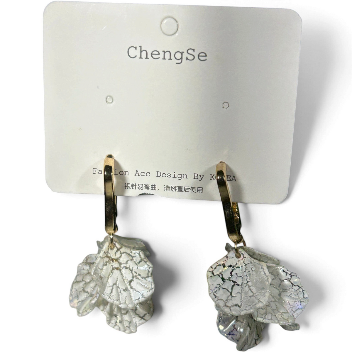 Providence Wholesale Silver floral petal drop hoop earrings with textured white charms on gold-tone metal bases.