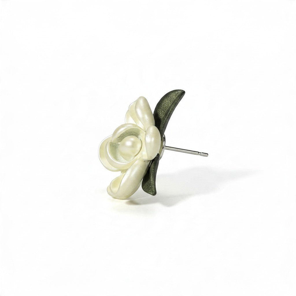Providence Wholesale Silver floral stud earrings with layered cream petals and a green leaf accent.