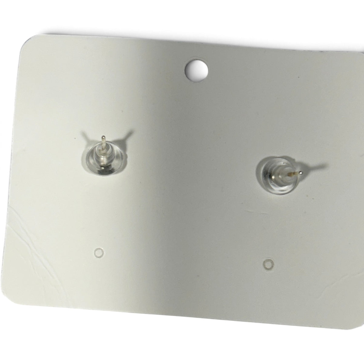Providence Wholesale Silver floral stud earrings back view with secure clear plastic and metal earring backs.