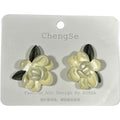 Providence Wholesale Silver floral stud earrings with cream layered petals and dark green leaf accents.