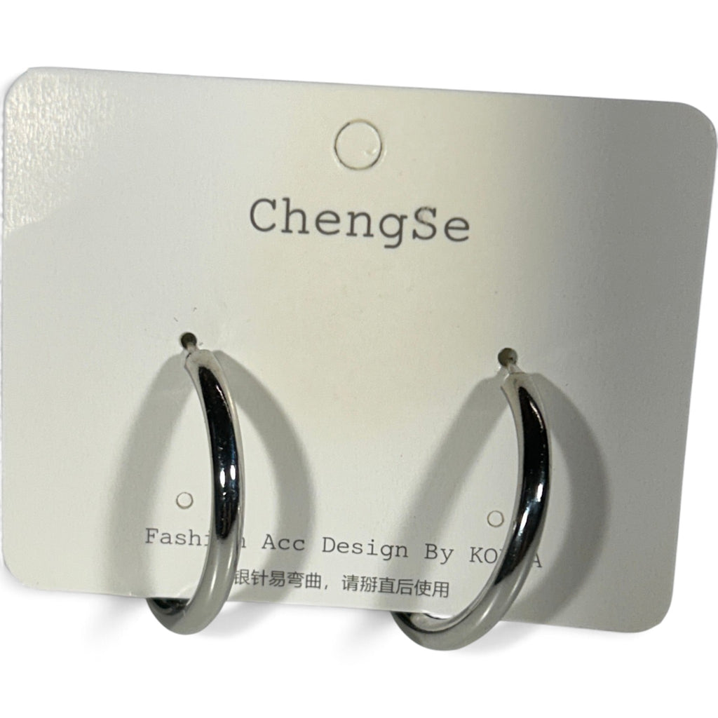 Providence Wholesale Silver polished silver-tone hoop clip-on earrings on a display card.