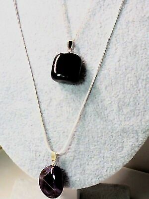 20 interchangeable semi-precious stones plus 2 sterling silver neck chain sizes