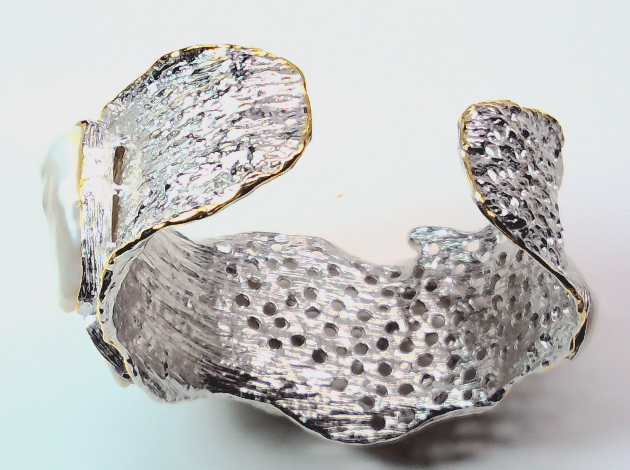 Handmade genuine .925 sterling silver bracelet laced with 14K gold overlay. Has large inlaid baroque pearls AAA grade. Truly a unique item.