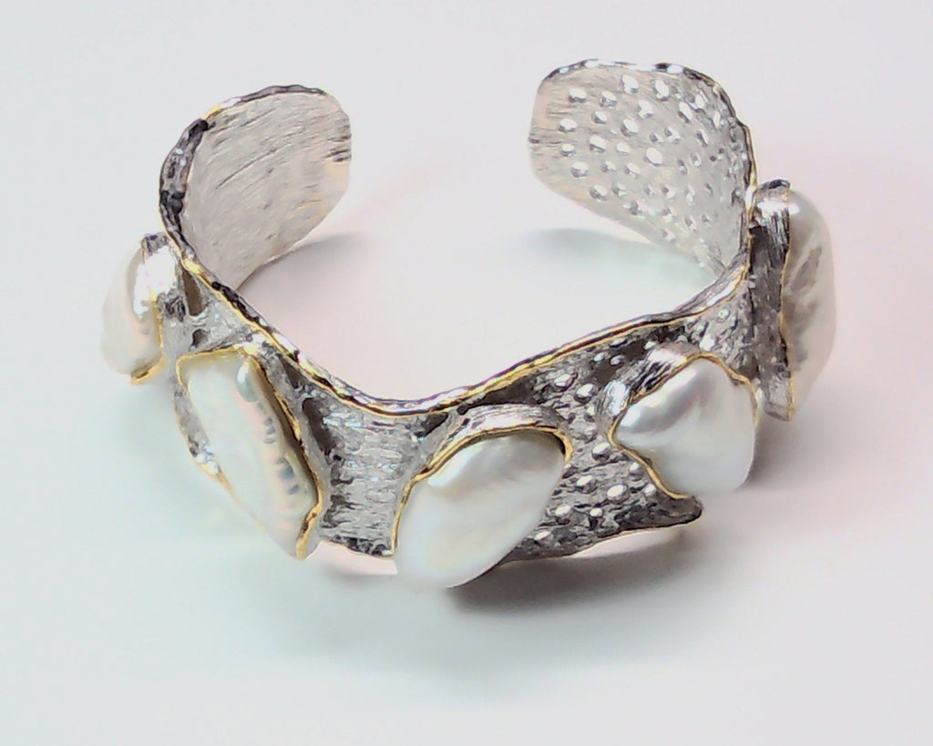 Handmade genuine .925 sterling silver bracelet laced with 14K gold overlay. Has large inlaid baroque pearls AAA grade. Truly a unique item.