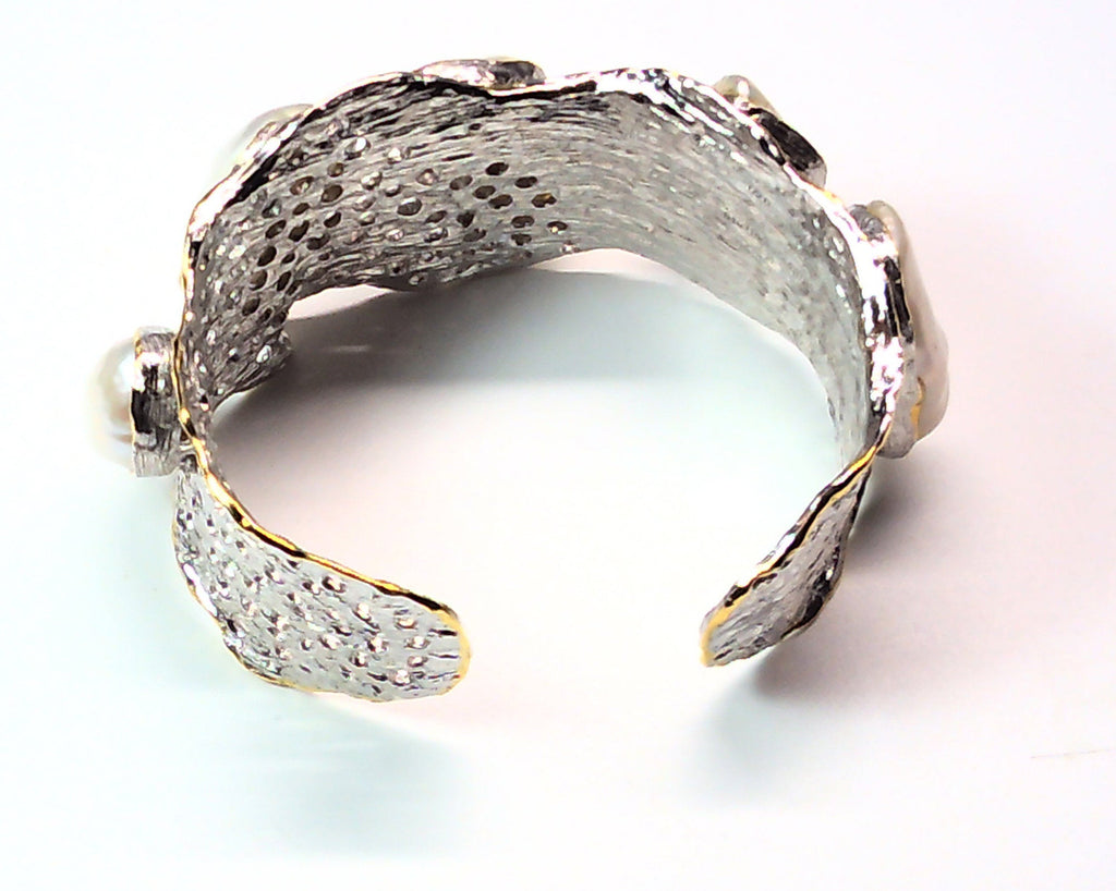 Handmade genuine .925 sterling silver bracelet laced with 14K gold overlay. Has large inlaid baroque pearls AAA grade. Truly a unique item.