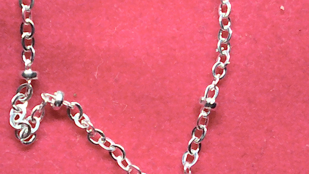 Sterling silver starfish pendant with a fancy cable and ball chain.