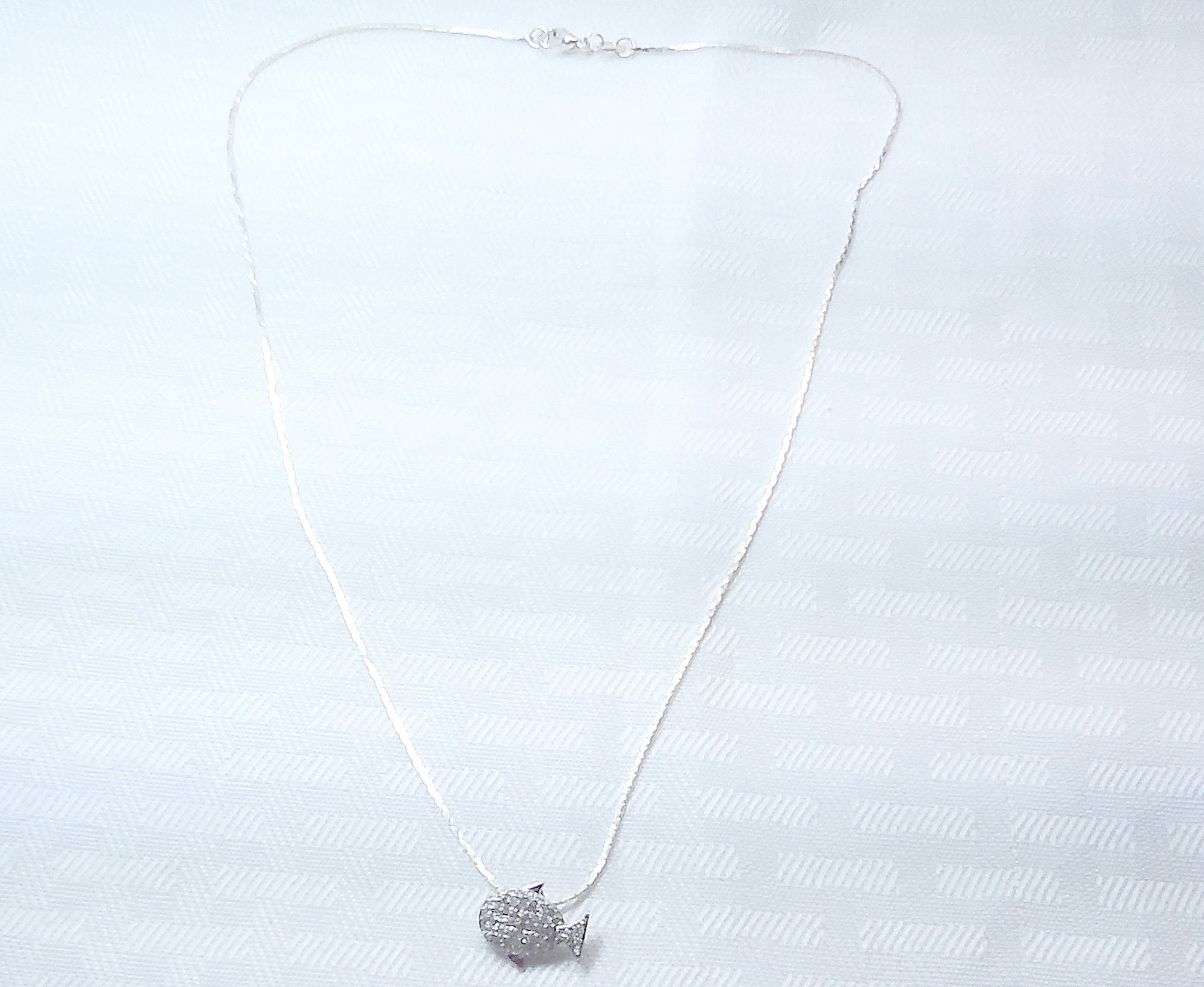 Sterling silver fish pendant with cubic zirconia stones